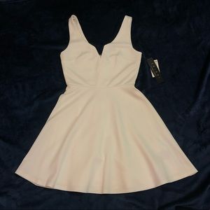 Simple White Dress with a Décolletage Neckline